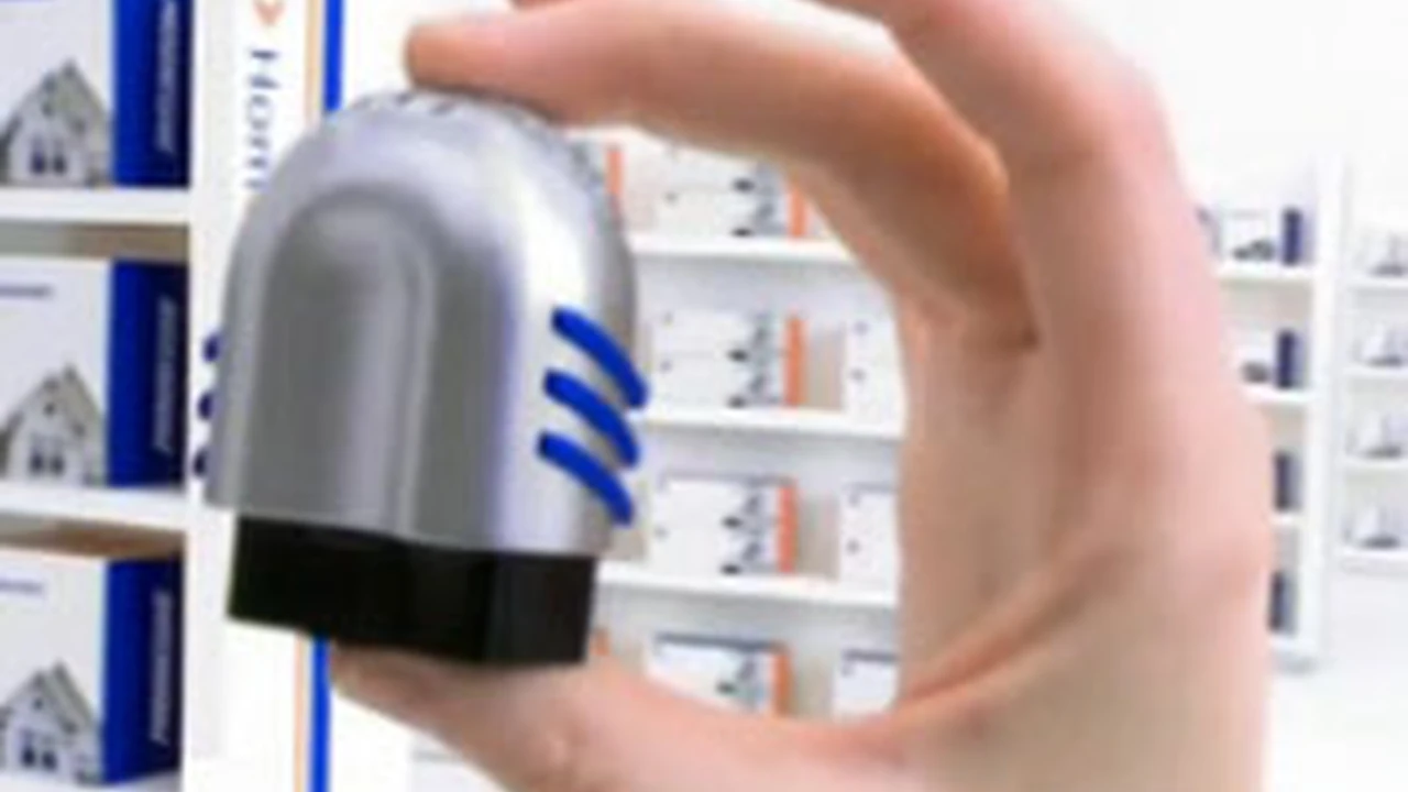 Close up on a plate of mashed potatoes, topped with baked pork chops with cream of mushroom soup, and a side of green beans.