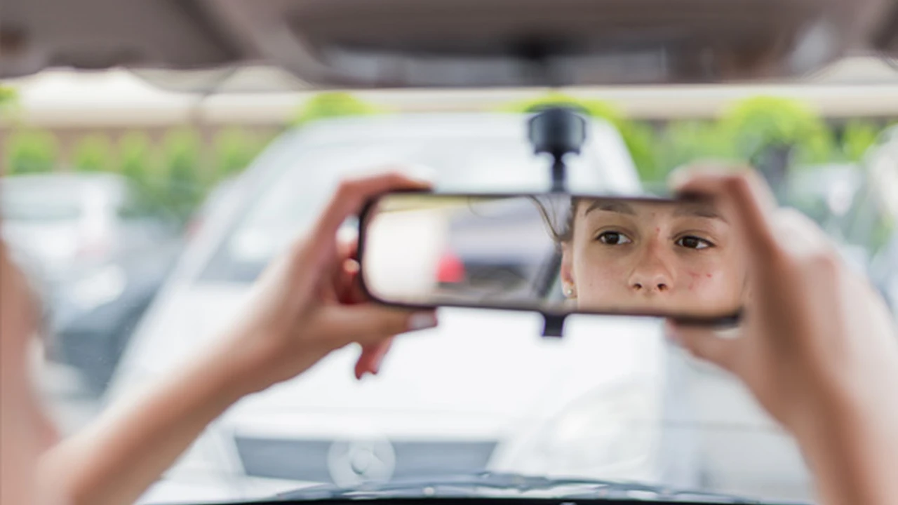 Two mint chocolate milkshakes with whipped cream and green sprinkles.