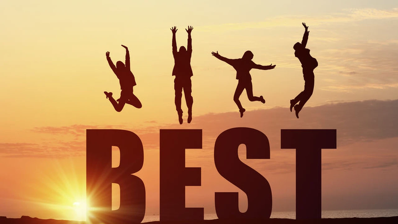 Close up on a plate of mashed potatoes, topped with baked pork chops with cream of mushroom soup, and a side of green beans.