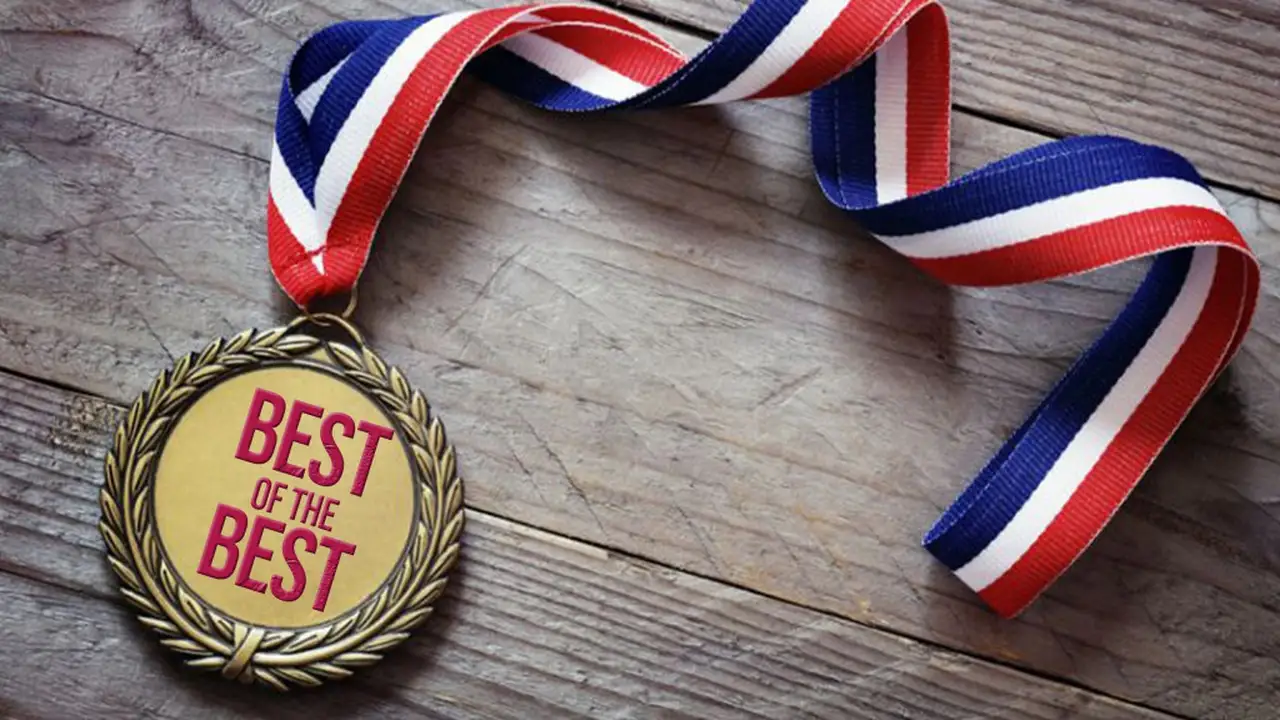 Close up on a plate of mashed potatoes, topped with baked pork chops with cream of mushroom soup, and a side of green beans.
