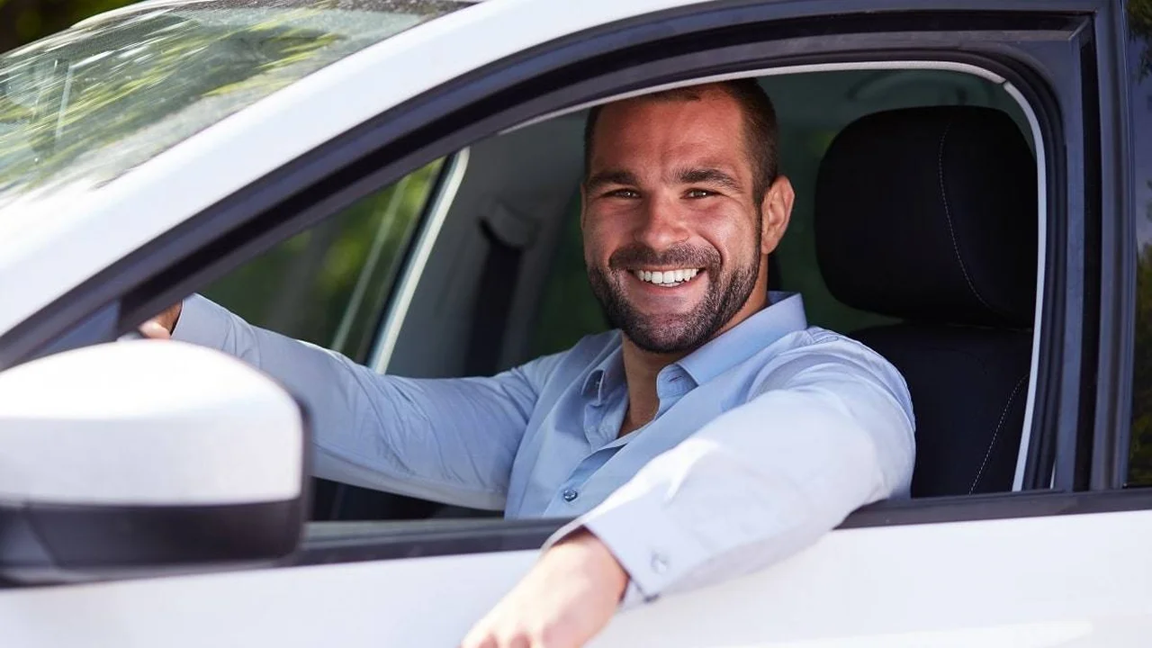 Close up on a plate of mashed potatoes, topped with baked pork chops with cream of mushroom soup, and a side of green beans.